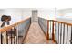 Hallway with wrought iron banister, herringbone floors, and a ceiling fan at 2091 Marlin Way, Englewood, FL 34224