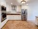 Modern kitchen with white cabinetry, stainless steel appliances, and stylish countertops at 2091 Marlin Way, Englewood, FL 34224