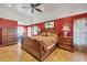 The bedroom features a spacious layout with hardwood floors and a large window for natural light at 2091 Marlin Way, Englewood, FL 34224
