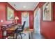 Home office featuring a large desk, bench, and a window offering natural light at 2091 Marlin Way, Englewood, FL 34224