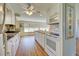 Bright kitchen featuring white cabinets, wood countertop island, and stainless-steel appliances at 3364 Goldfinch Ln, Englewood, FL 34224