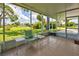 Relaxing screened porch overlooking a lush green yard at 3364 Goldfinch Ln, Englewood, FL 34224