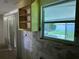 Sunlit kitchen awaiting renovation, with an abundance of natural light and an opportunity to customize at 3485 Roslyn Rd, Venice, FL 34293