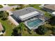 Aerial view of home with pool and lush landscaping at 221 Malvern Dr, Venice, FL 34293