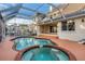 Relaxing pool and spa with a screened enclosure at 2091 Marlin Way, Englewood, FL 34224