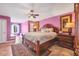 Spacious bedroom with wood furniture and a window seat at 2091 Marlin Way, Englewood, FL 34224