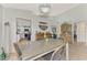 Bright dining room with a rustic wooden hutch and view of the kitchen at 803 Harrington Lake N Dr # 75, Venice, FL 34293