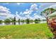 Scenic view of lake and lush green landscape at 803 Harrington Lake N Dr # 75, Venice, FL 34293