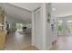 View of a bright and spacious hallway leading to the living room and kitchen at 803 Harrington Lake N Dr # 75, Venice, FL 34293