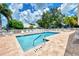 Inviting community pool with lounge chairs and patio area at 803 Harrington Lake N Dr # 75, Venice, FL 34293