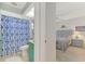 Clean bathroom with shower/tub combo and teal vanity at 803 Harrington Lake N Dr # 75, Venice, FL 34293