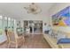 Sunroom with water views, seating area, and dining table at 803 Harrington Lake N Dr # 75, Venice, FL 34293
