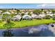 Aerial view of home and community, showcasing waterfront location at 803 Harrington Lake N Dr # 75, Venice, FL 34293