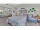 Cozy bedroom featuring water views and comfortable seating at 803 Harrington Lake N Dr # 75, Venice, FL 34293
