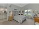 Main bedroom with water views, a ceiling fan, and a tranquil atmosphere at 803 Harrington Lake N Dr # 75, Venice, FL 34293