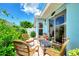 Relaxing patio with wicker furniture, perfect for outdoor dining at 803 Harrington Lake N Dr # 75, Venice, FL 34293