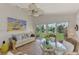 Bright sunroom with water views and comfortable seating at 803 Harrington Lake N Dr # 75, Venice, FL 34293