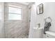 Clean bathroom with marble-tiled shower and modern sink at 4090 Pelican Shores Cir, Englewood, FL 34223