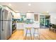 Updated kitchen featuring stainless steel appliances and a breakfast bar at 4090 Pelican Shores Cir, Englewood, FL 34223