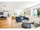 Open living area with modern furniture and large windows at 4090 Pelican Shores Cir, Englewood, FL 34223