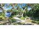 Peaceful nature trail leading through lush vegetation at 4090 Pelican Shores Cir, Englewood, FL 34223