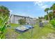 Backyard with two paddle boats and a view of the canal at 6 Cove Ln, Englewood, FL 34223