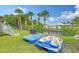 Backyard with two paddle boats and a view of the canal at 6 Cove Ln, Englewood, FL 34223