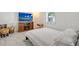 Basement bedroom with a TV and electric fireplace at 6 Cove Ln, Englewood, FL 34223