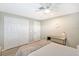 Bedroom with double doors and a light neutral color scheme at 6 Cove Ln, Englewood, FL 34223