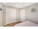 Guest bedroom with double bed, spacious closet and wood-look flooring at 6 Cove Ln, Englewood, FL 34223