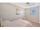 Bedroom with a double bed, window, and artwork at 6 Cove Ln, Englewood, FL 34223