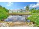 Convenient canal access with steps leading down to the water at 6 Cove Ln, Englewood, FL 34223