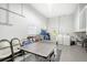 Game room with ping pong table, laundry, and storage at 6 Cove Ln, Englewood, FL 34223