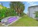 Kayaks and paddleboards are stored on a concrete pad in the backyard at 6 Cove Ln, Englewood, FL 34223