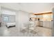 Open concept kitchen and bedroom with stainless steel appliances at 6 Cove Ln, Englewood, FL 34223