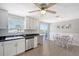 Kitchen with stainless steel appliances and access to a patio at 6 Cove Ln, Englewood, FL 34223
