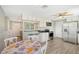Modern kitchen with stainless steel appliances and white cabinets at 6 Cove Ln, Englewood, FL 34223