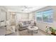 Bright living room with gray sofa and coffee table at 6 Cove Ln, Englewood, FL 34223