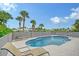 Inviting kidney-shaped pool with lounge chairs; perfect for relaxation at 6 Cove Ln, Englewood, FL 34223
