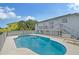 Inviting kidney-shaped pool with deck and steps; perfect for relaxation at 6 Cove Ln, Englewood, FL 34223