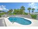 Inviting kidney-shaped pool with lounge chairs; perfect for relaxation at 6 Cove Ln, Englewood, FL 34223