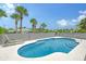 Inviting kidney-shaped pool with lounge chairs; perfect for relaxation at 6 Cove Ln, Englewood, FL 34223