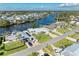 Aerial view of waterfront home with large lot and boat at 703 Portia N St, Nokomis, FL 34275