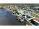 Bird's eye view of house on canal with dock and boats at 703 Portia N St, Nokomis, FL 34275