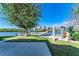 Waterfront backyard with hammock and seating at 703 Portia N St, Nokomis, FL 34275
