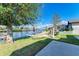 Backyard oasis with hammock and water view at 703 Portia N St, Nokomis, FL 34275