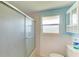 Bathroom with shower/tub combo and window at 703 Portia N St, Nokomis, FL 34275