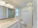 Updated bathroom with white vanity and walk-in shower at 703 Portia N St, Nokomis, FL 34275