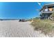 Lifeguard stand and beach with people at 703 Portia N St, Nokomis, FL 34275