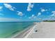 Relaxing beach with umbrella and ocean view at 703 Portia N St, Nokomis, FL 34275